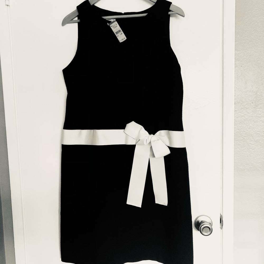 Black sheath dress with white bow